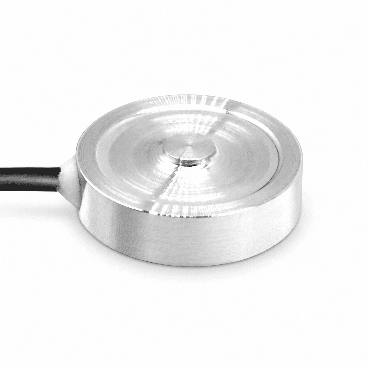 Low profile round button broad concentric top shallow center left cable.